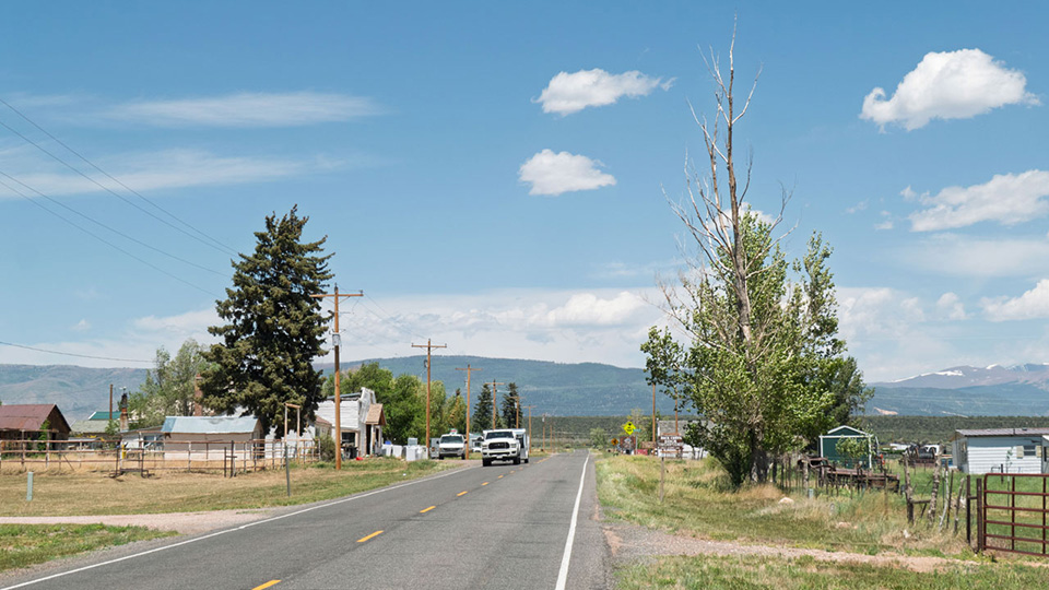 Houses and buildings of a small country town with Uinta Mountains in the background
